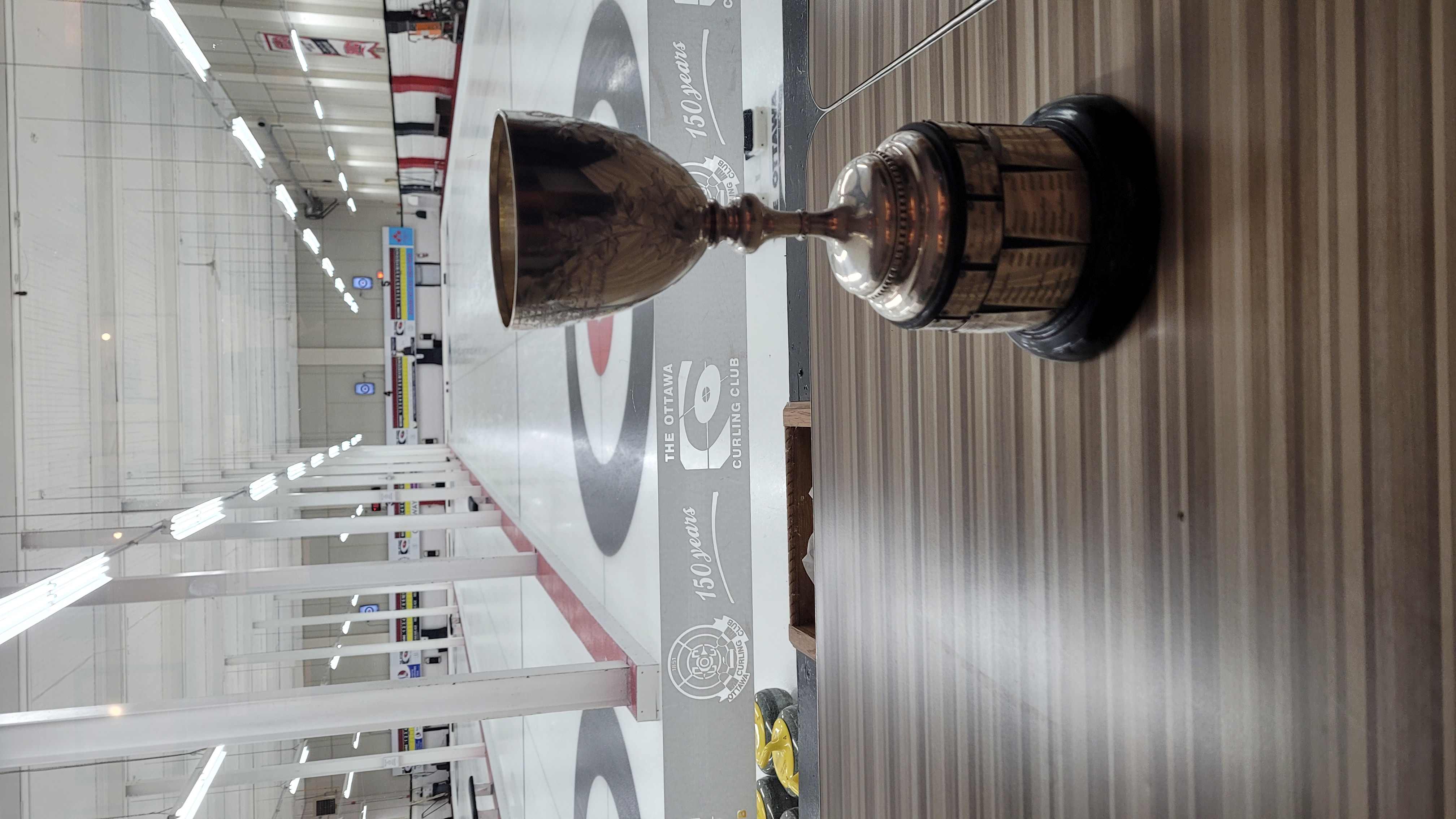 currier cup with empty curling rink in background